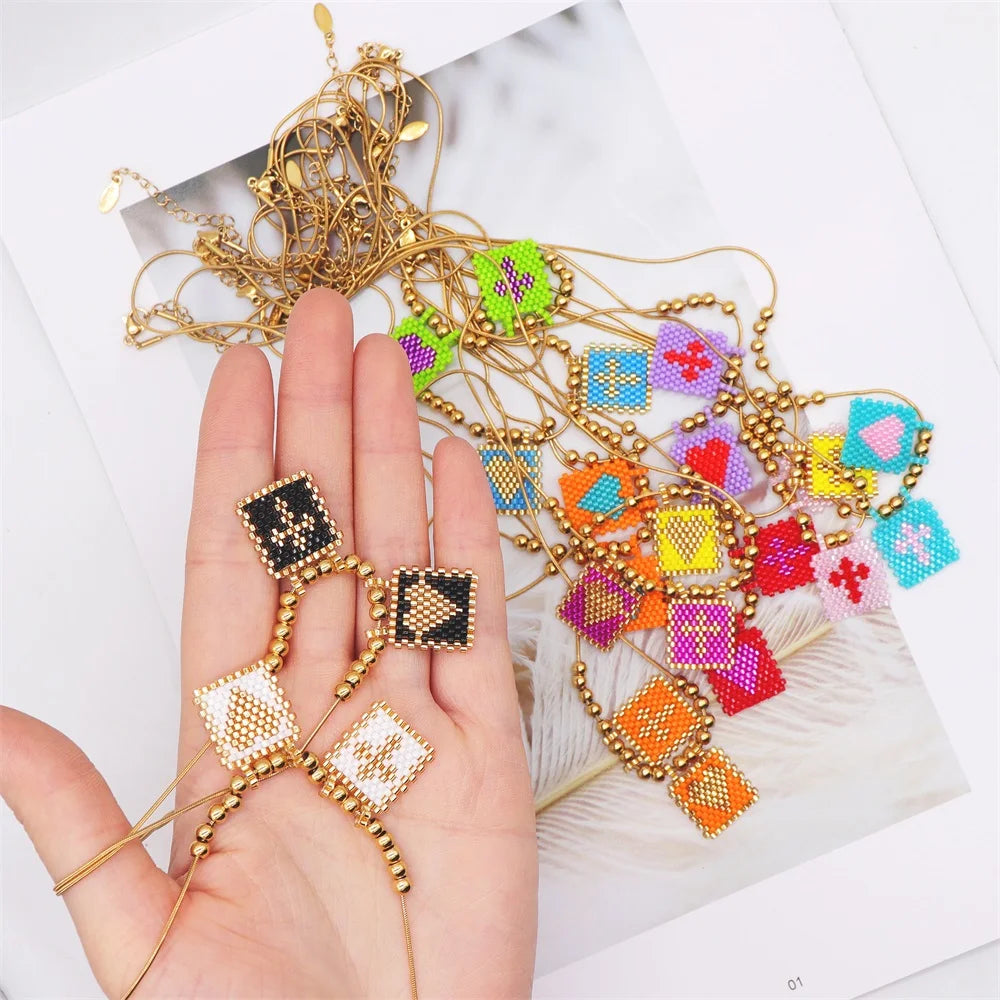 ZHONGVI Miyuki Heart Cross Pendant Necklace | Gold Plated Steel | Worldwide Shipping