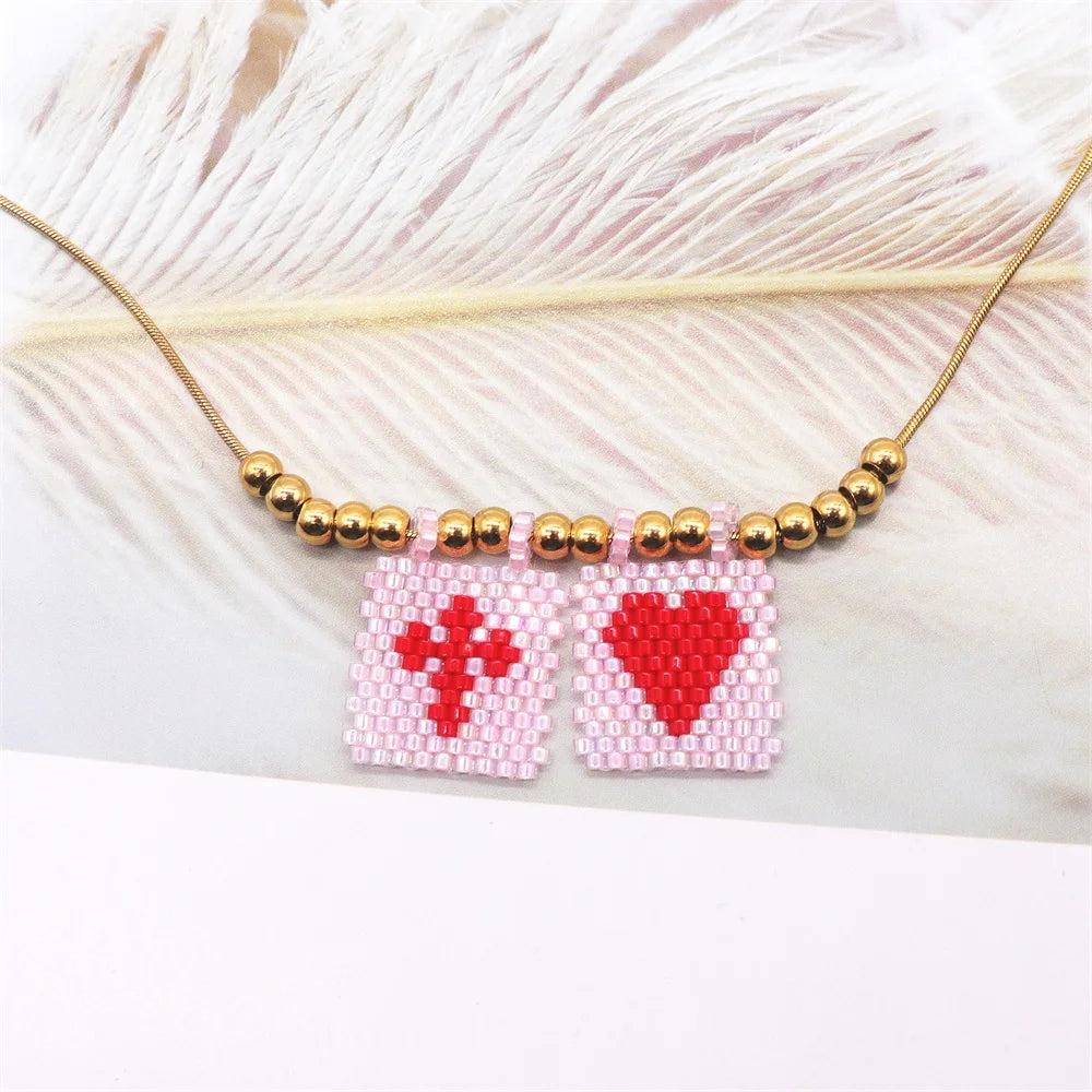 ZHONGVI Miyuki Heart Cross Pendant Necklace | Gold Plated Steel | Worldwide Shipping