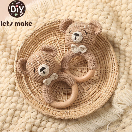 Two crocheted teddy bear toys with bows on a woven basket, branded 'Diy lets make'.