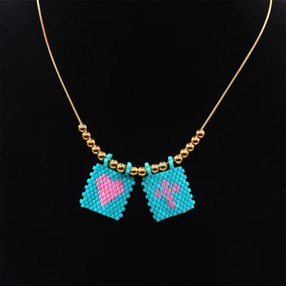 ZHONGVI Miyuki Heart Cross Pendant Necklace | Gold Plated Steel | Worldwide Shipping