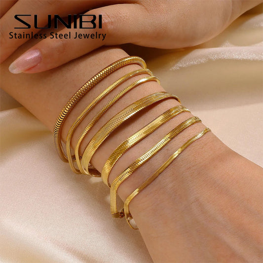 Gold bracelets on a wrist with 'SUNIBI Stainless Steel Jewelry' branding.