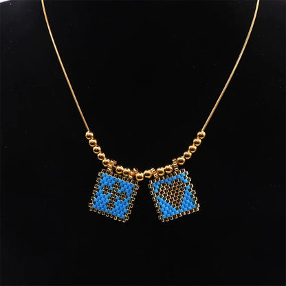 ZHONGVI Miyuki Heart Cross Pendant Necklace | Gold Plated Steel | Worldwide Shipping